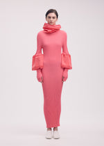 A model wears the ISSEY MIYAKE THIN AND THICK KNIT dress.