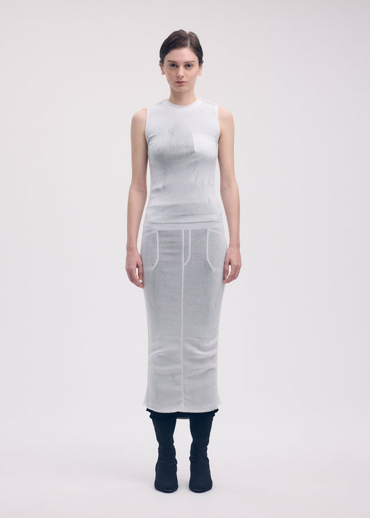 A model wears the Issey Miyake SEEN UNSEEN AP dress.