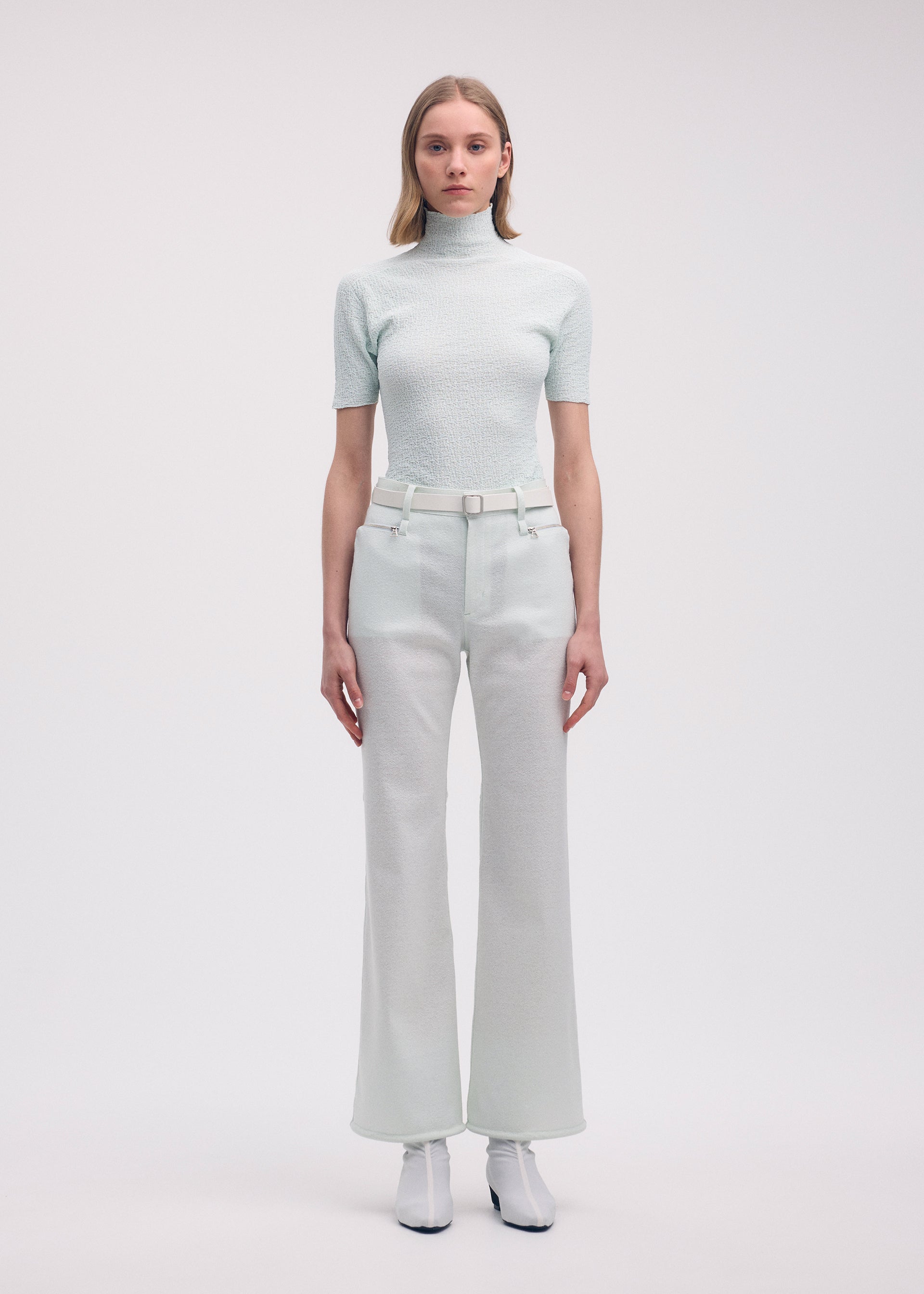 A model wears the Issey Miyake BODY KNIT top.