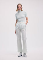 A model wears the Issey Miyake BODY KNIT top.