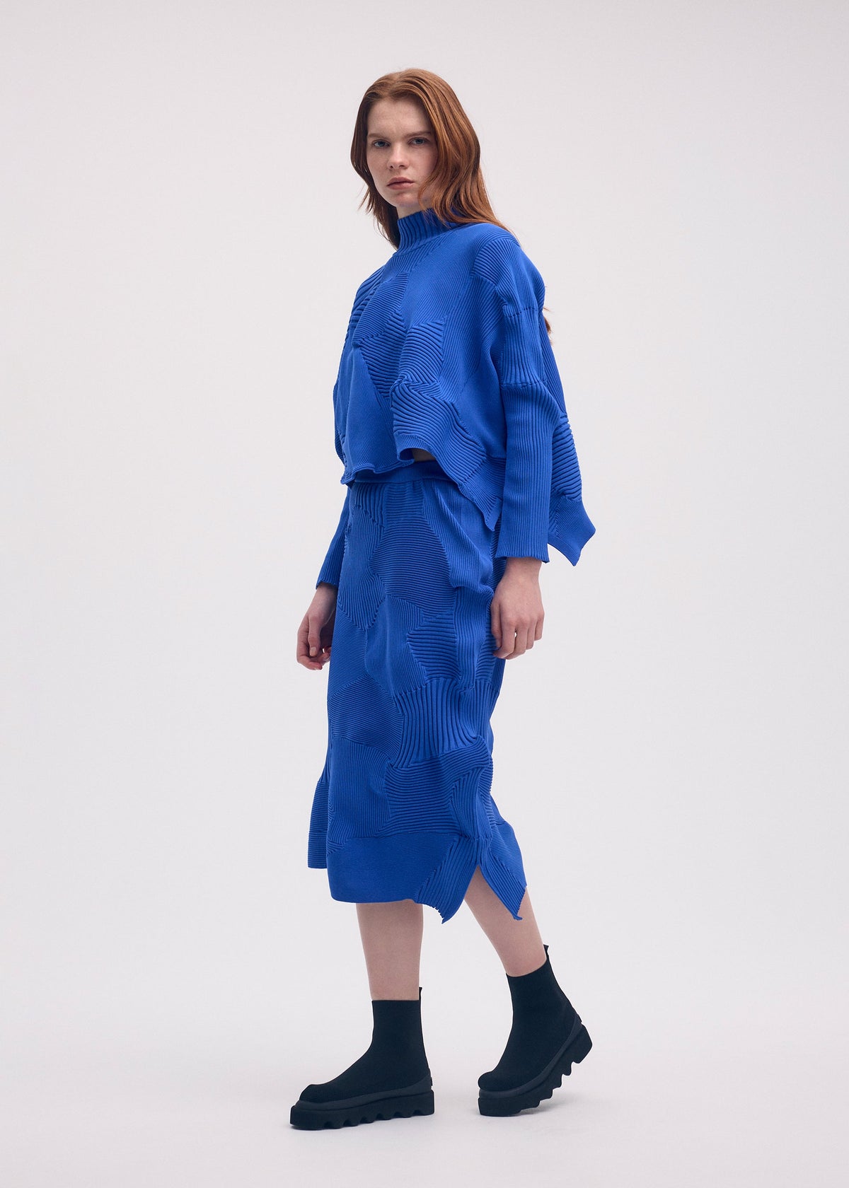 A model wears the Issey Miyake KONE KONE top.