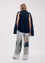 A model wears the Issey Miyake BREEZE KNIT top.