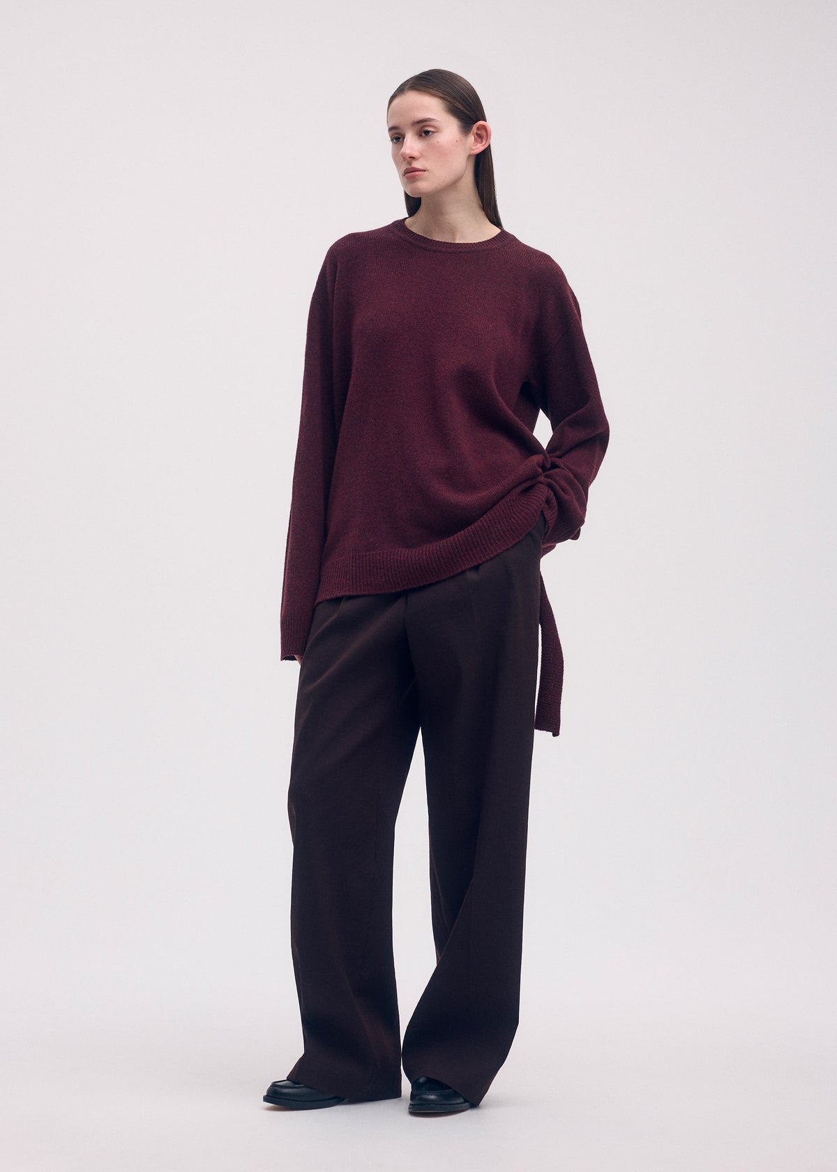 A model wears the Issey Miyake BACKPACK KNIT top.