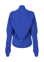 A detail shot of the ISSEY MIYAKE DISPLACED KNIT cardigan.