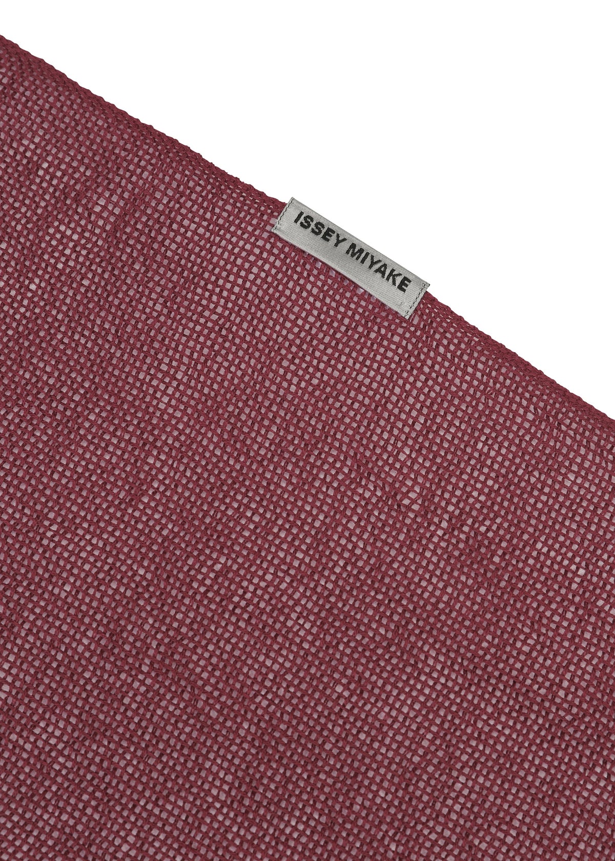 A detail shot of the ISSEY MIYAKE SLITS STOLE stole.