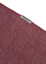 A detail shot of the ISSEY MIYAKE SLITS STOLE stole.