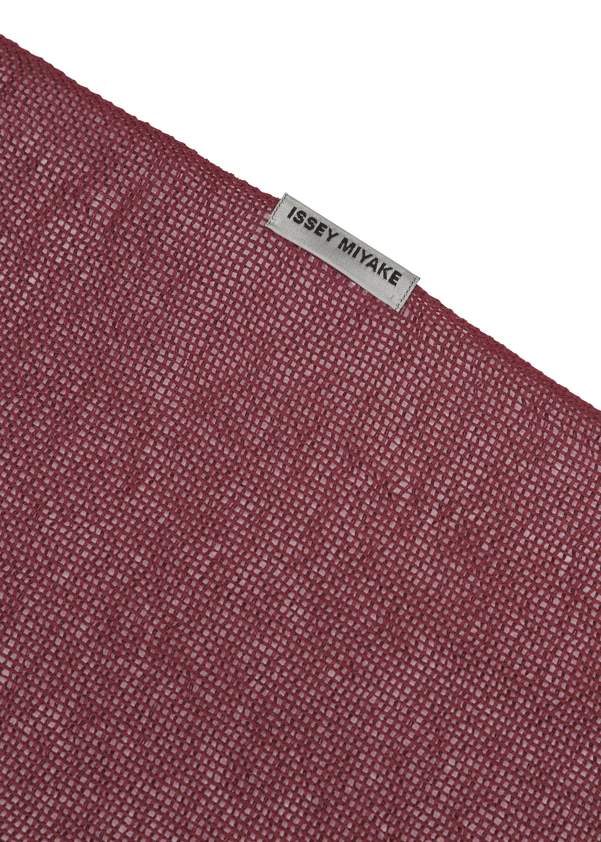 A detail shot of the ISSEY MIYAKE SLITS STOLE stole.