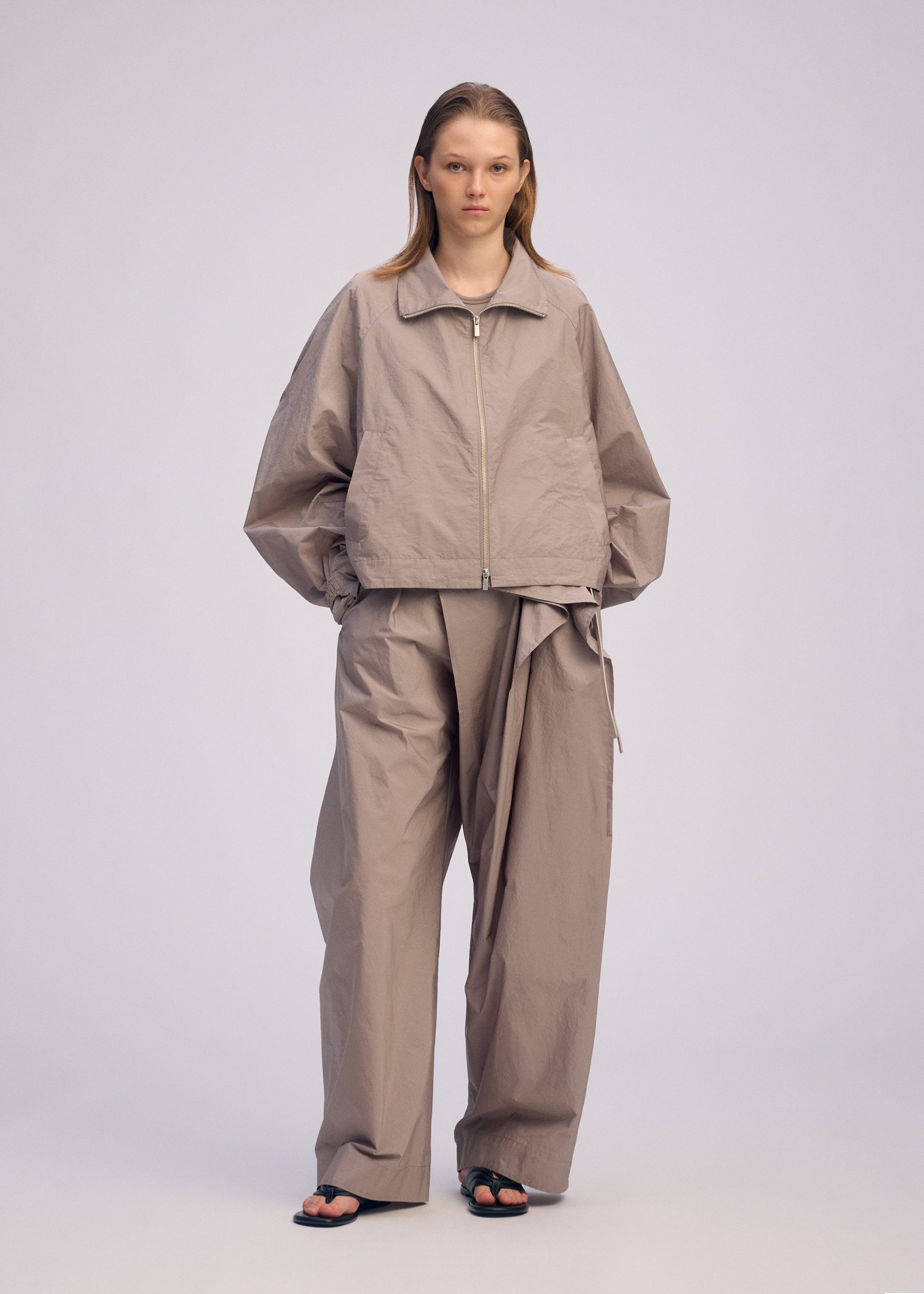 A model wears the ISSEY MIYAKE AKIMBO prêt à porter.