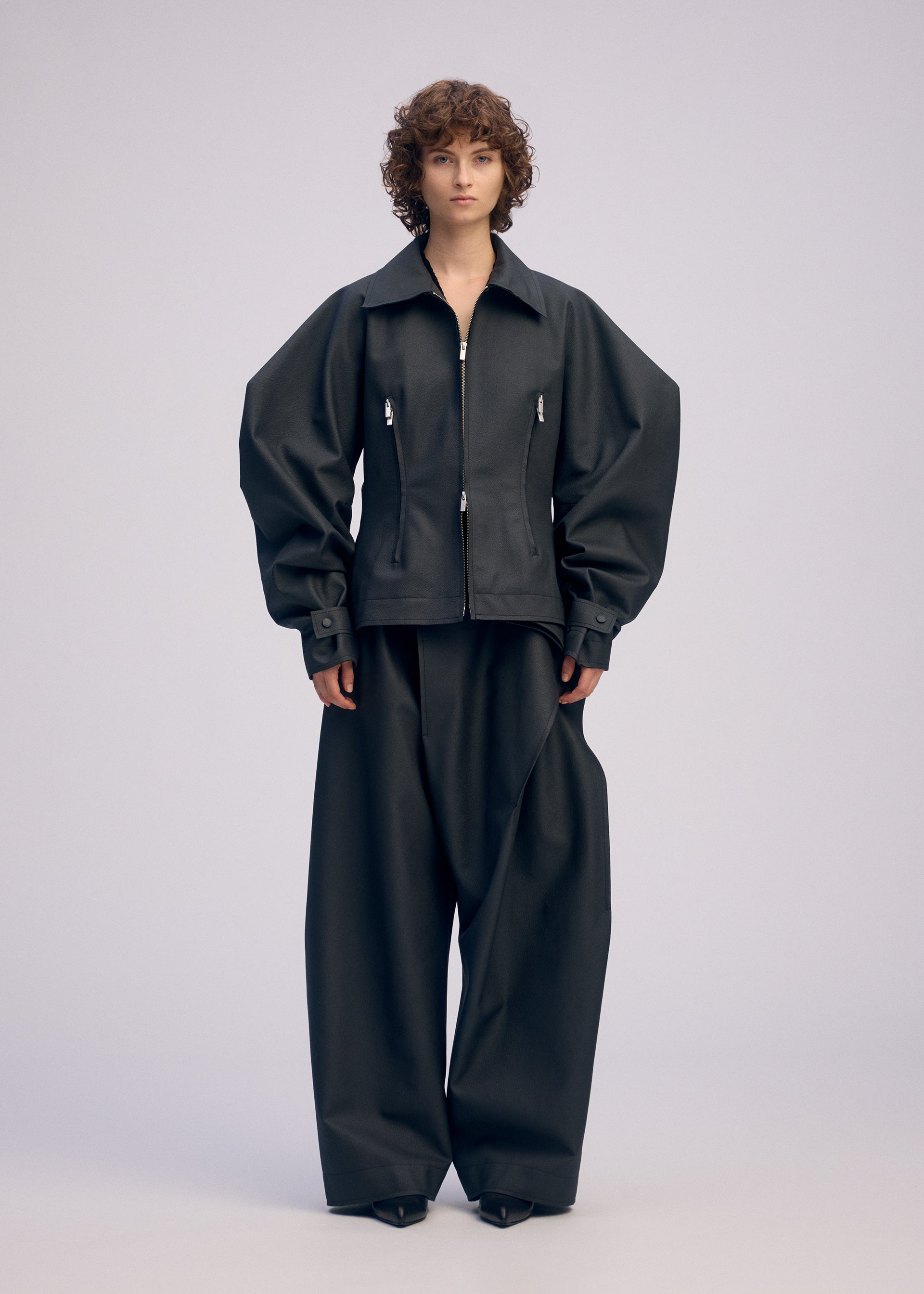A model wears the ISSEY MIYAKE PRONOUNCED BODY prêt à porter.