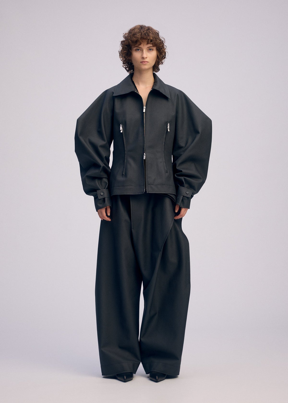 A model wears the ISSEY MIYAKE PRONOUNCED BODY prêt à porter.