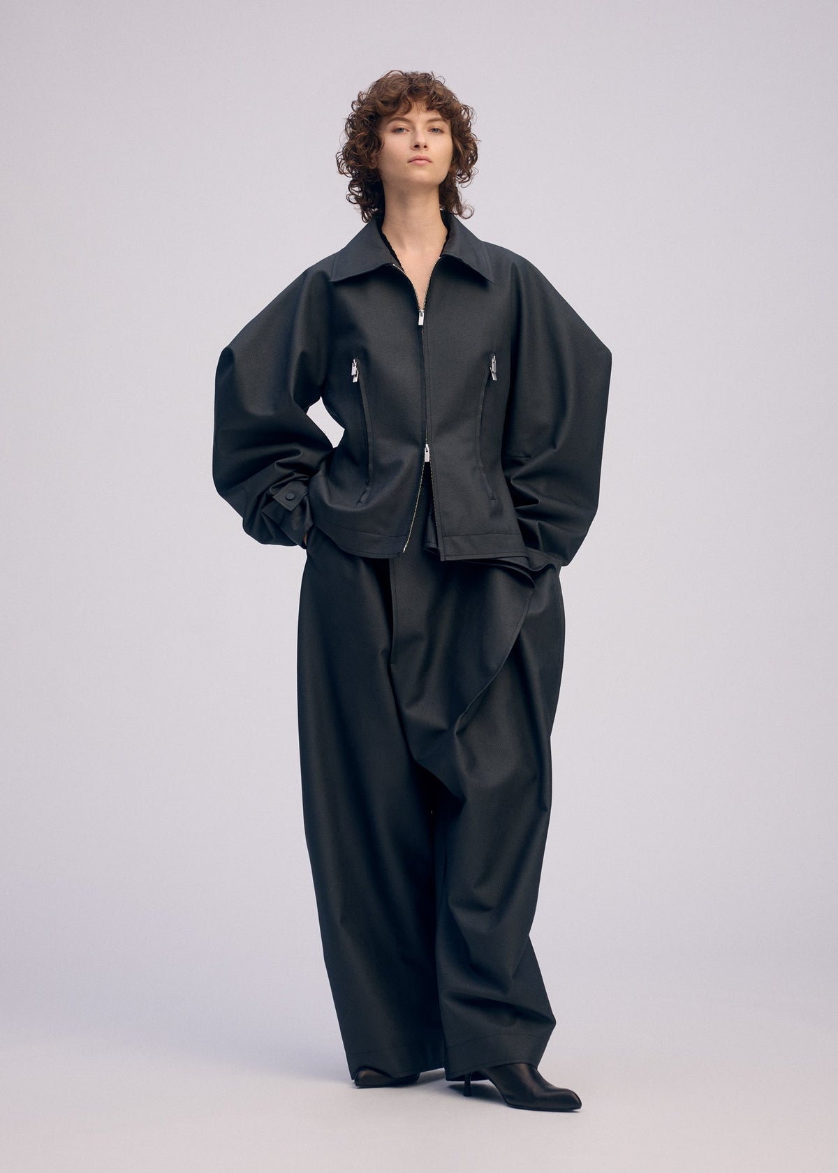 A model wears the ISSEY MIYAKE PRONOUNCED BODY prêt à porter.