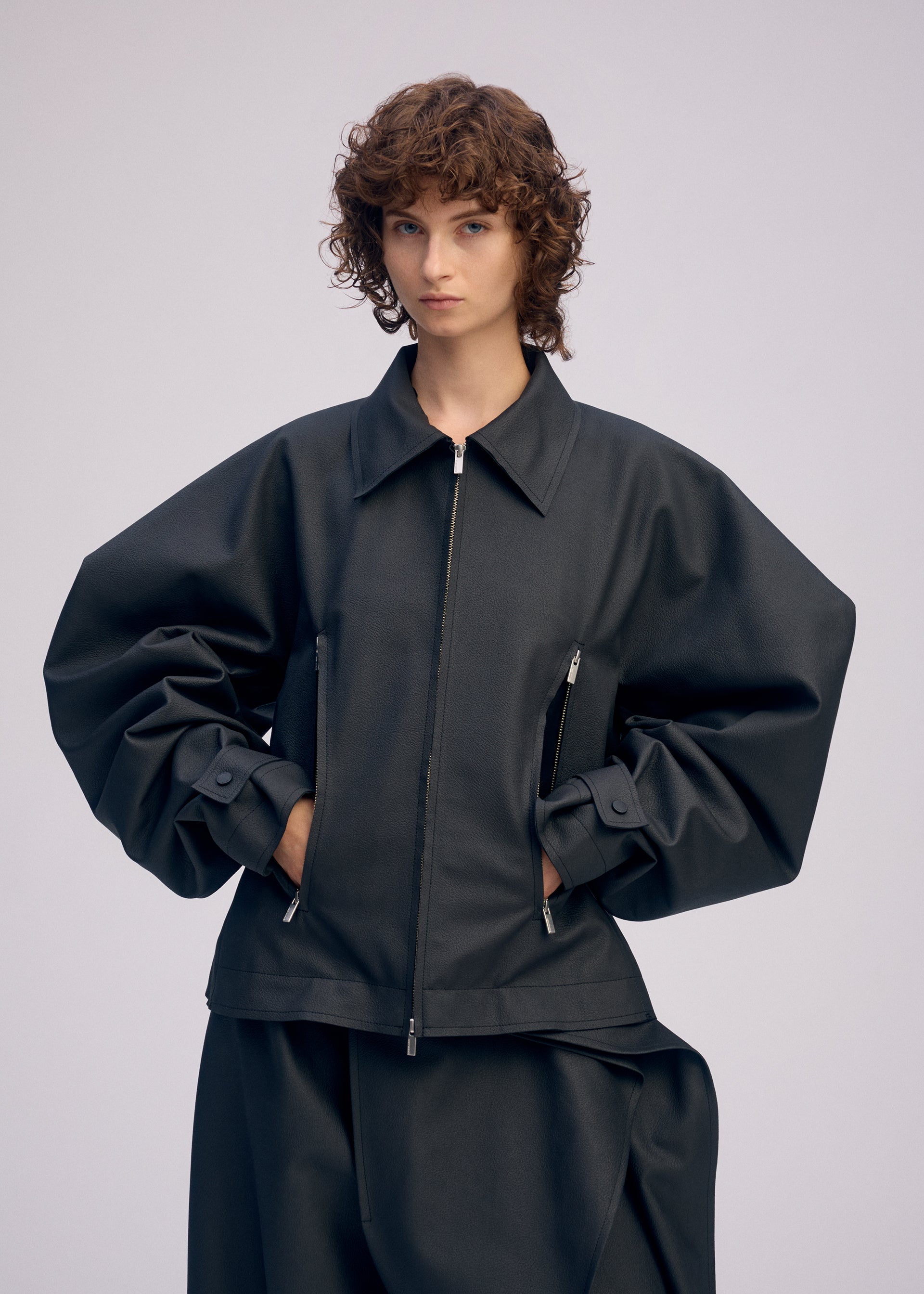 A model wears the ISSEY MIYAKE PRONOUNCED BODY prêt à porter.