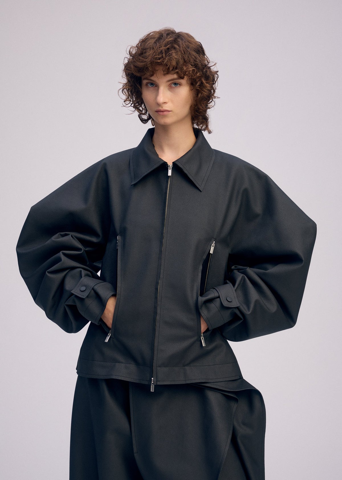 A model wears the ISSEY MIYAKE PRONOUNCED BODY prêt à porter.