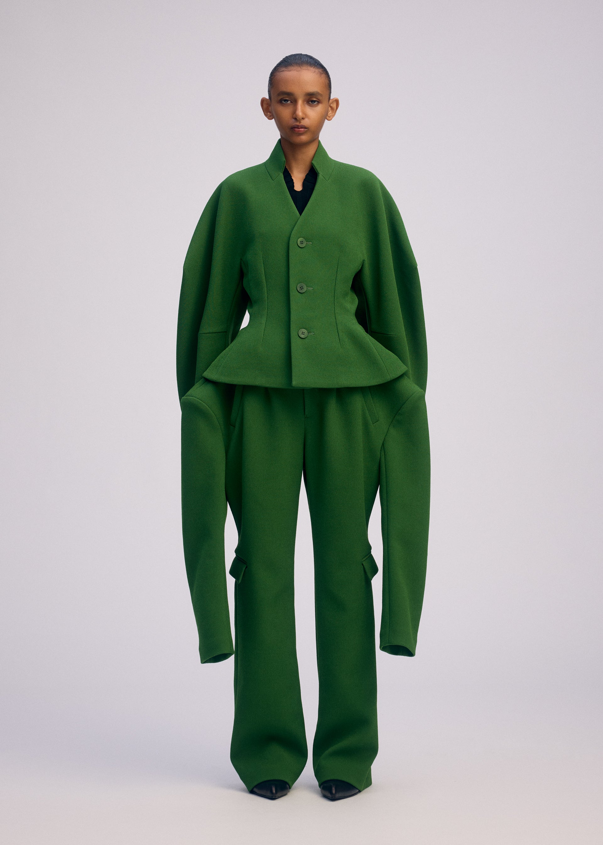 A model wears the ISSEY MIYAKE ARMS prêt à porter.