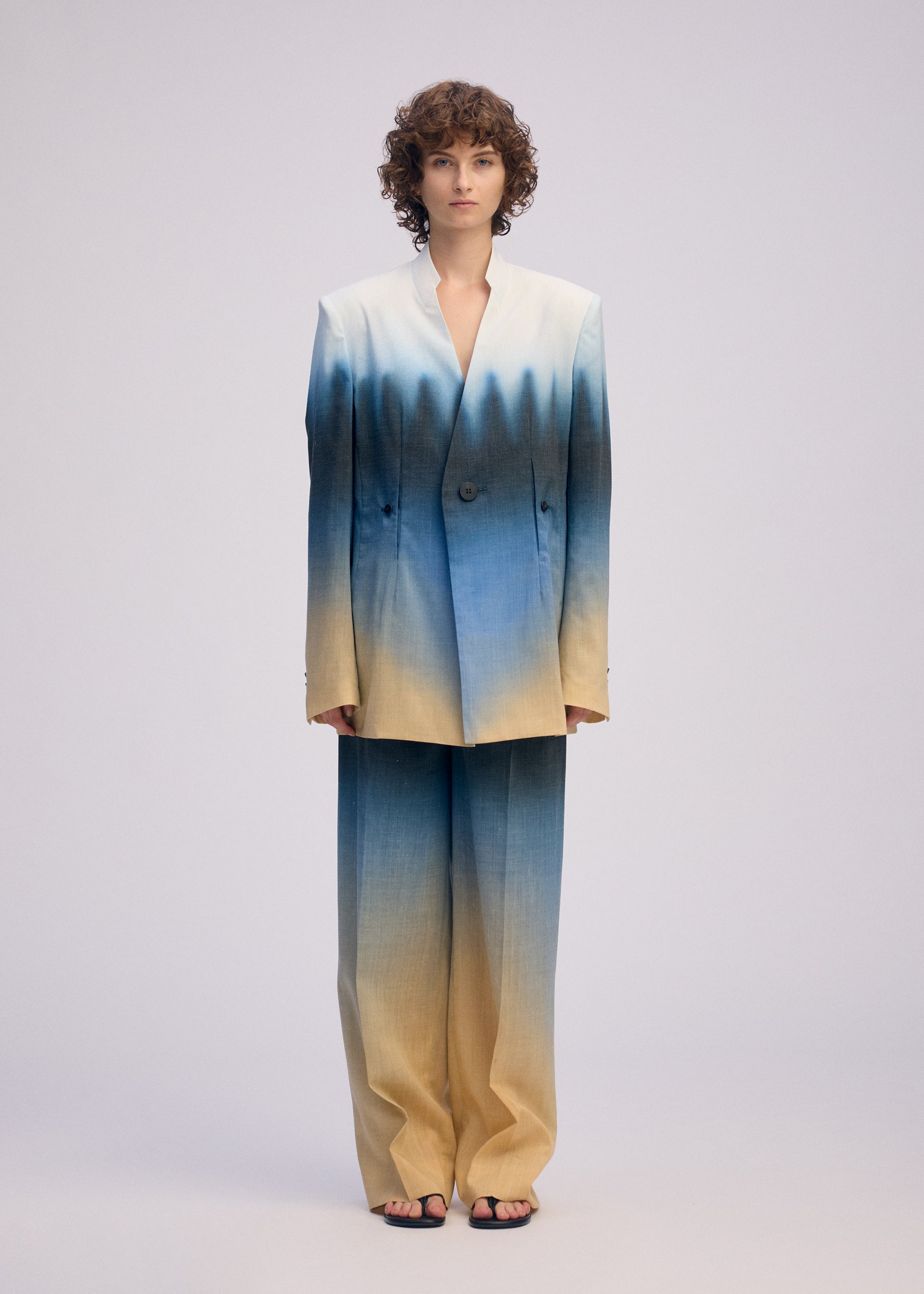 A model wears the ISSEY MIYAKE PLUMAGE plumage-jacket-starling-1.
