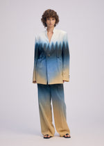 A model wears the ISSEY MIYAKE PLUMAGE plumage-jacket-starling-1.