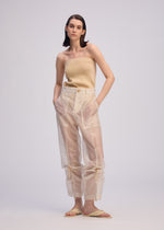 A model wears the Issey Miyake DRAW TO FORM pants.
