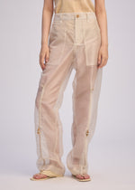 A model wears the Issey Miyake DRAW TO FORM pants.