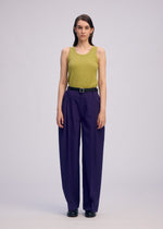 A model wears the Issey Miyake BELTED WOOL PANTS prêt à porter.
