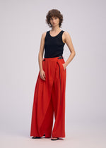 A model wears the Issey Miyake LOOPED pants.