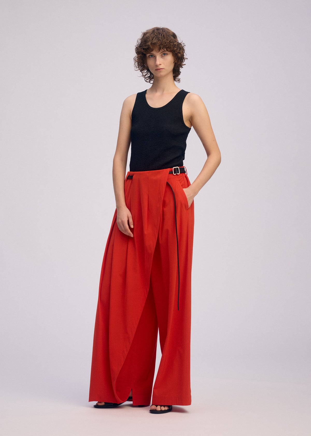 A model wears the Issey Miyake LOOPED pants.