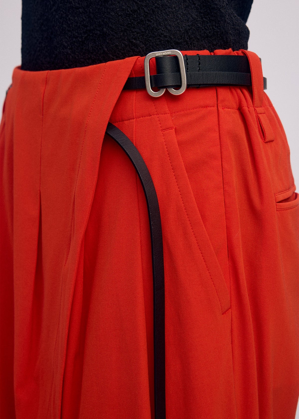 A model wears the Issey Miyake LOOPED pants.