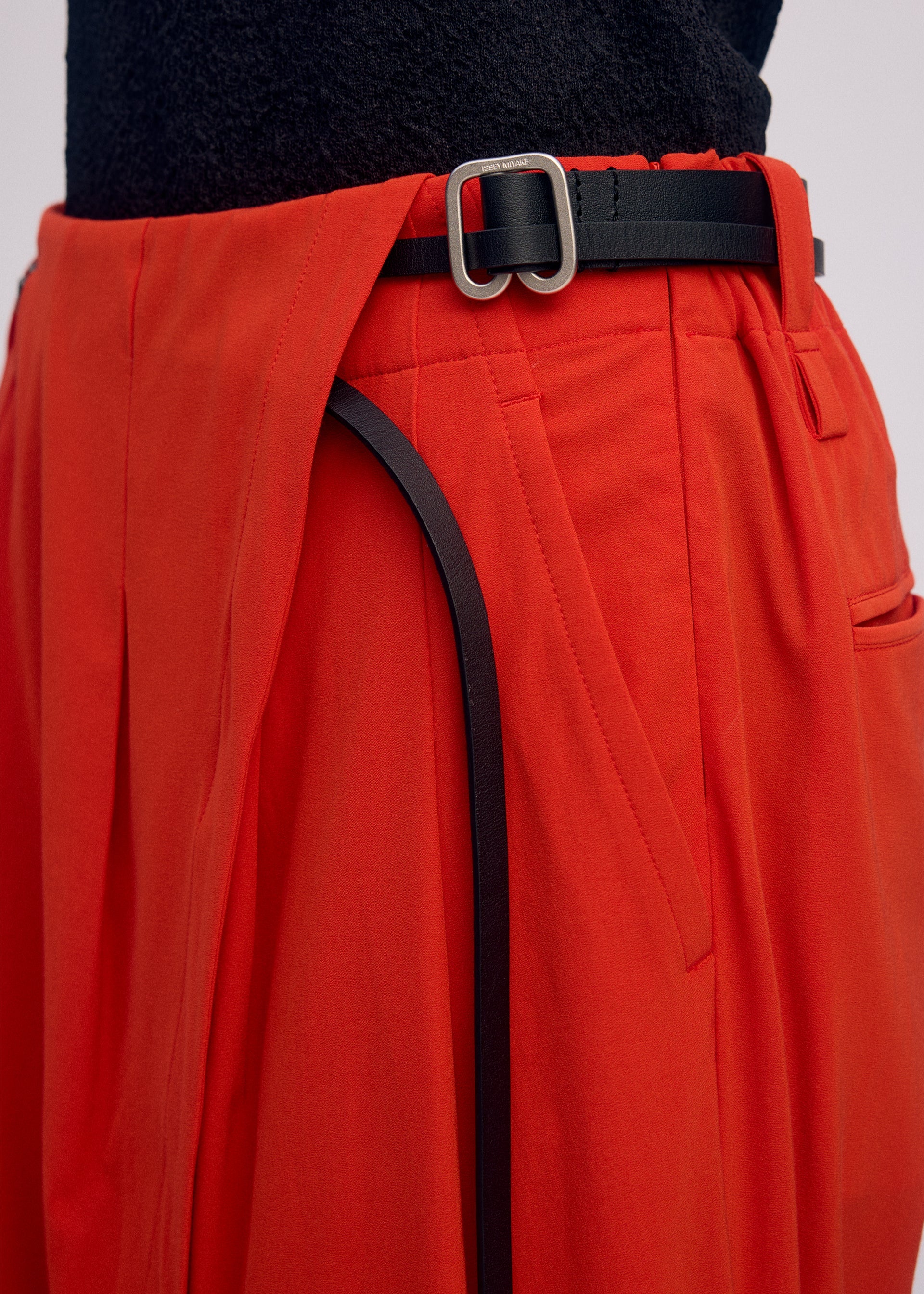 A model wears the Issey Miyake LOOPED pants.