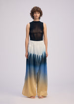 A model wears the ISSEY MIYAKE PLUMAGE plumage-pants-chukar-2.