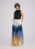 A model wears the ISSEY MIYAKE PLUMAGE plumage-pants-chukar-2.