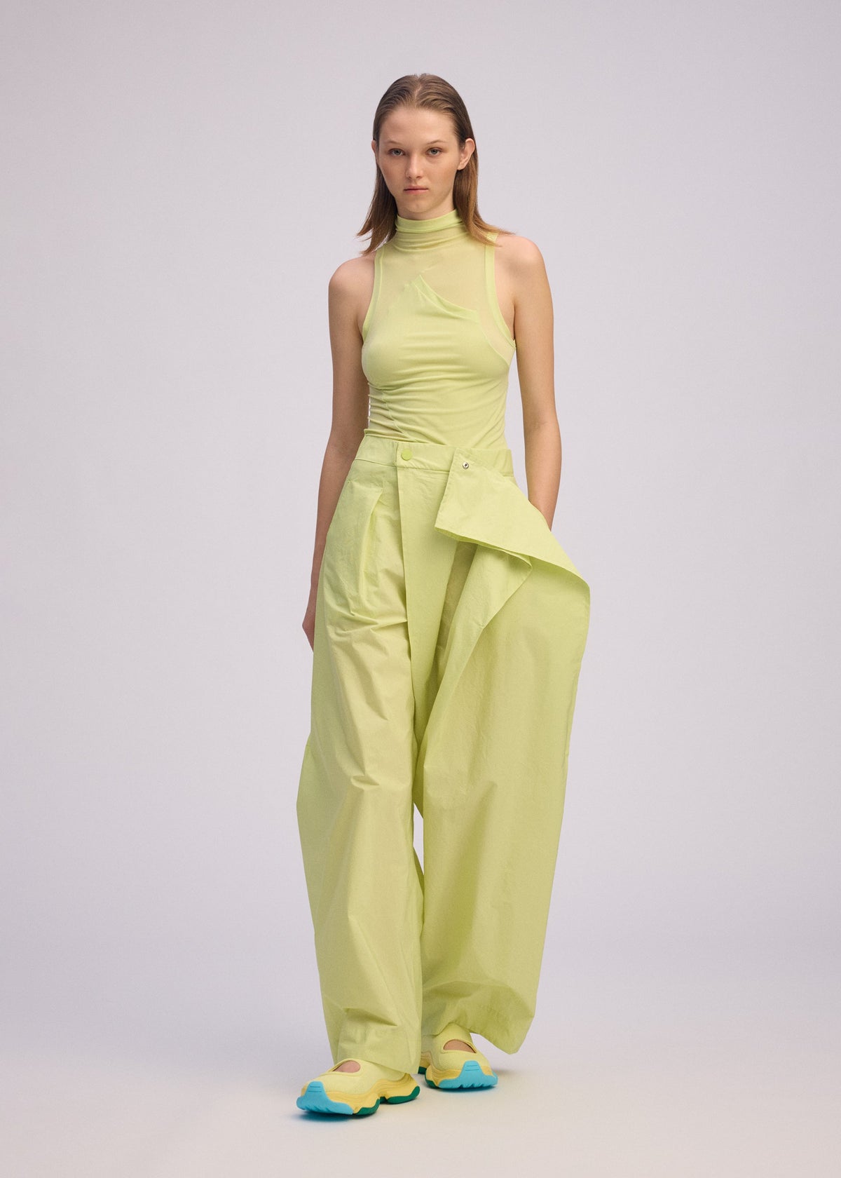 A model wears the ISSEY MIYAKE AKIMBO prêt à porter.