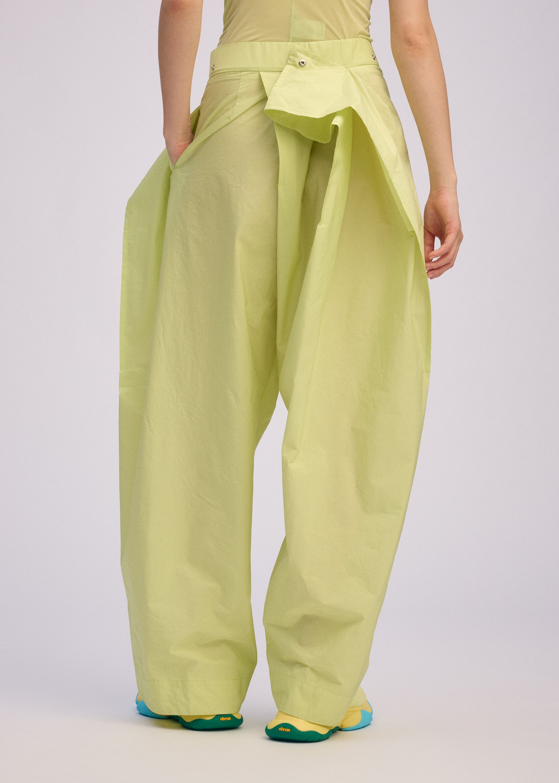 A model wears the ISSEY MIYAKE AKIMBO prêt à porter.