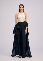 A model wears the ISSEY MIYAKE ALL SQUARES pants.