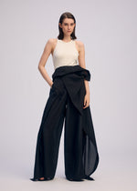 A model wears the ISSEY MIYAKE ALL SQUARES pants.