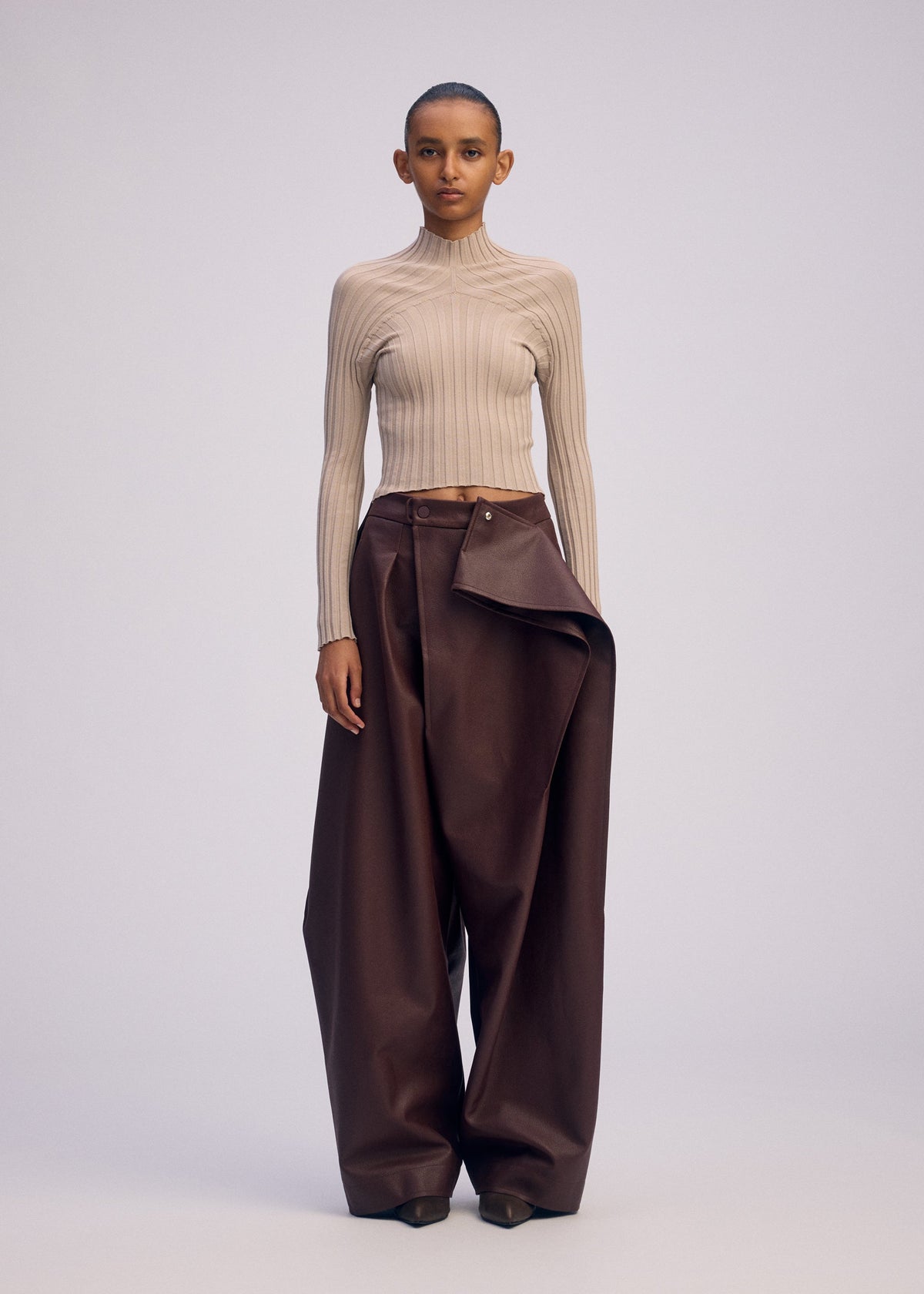 A model wears the ISSEY MIYAKE PRONOUNCED BODY prêt à porter.