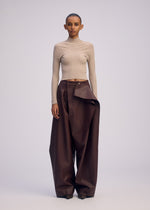 A model wears the ISSEY MIYAKE PRONOUNCED BODY prêt à porter.