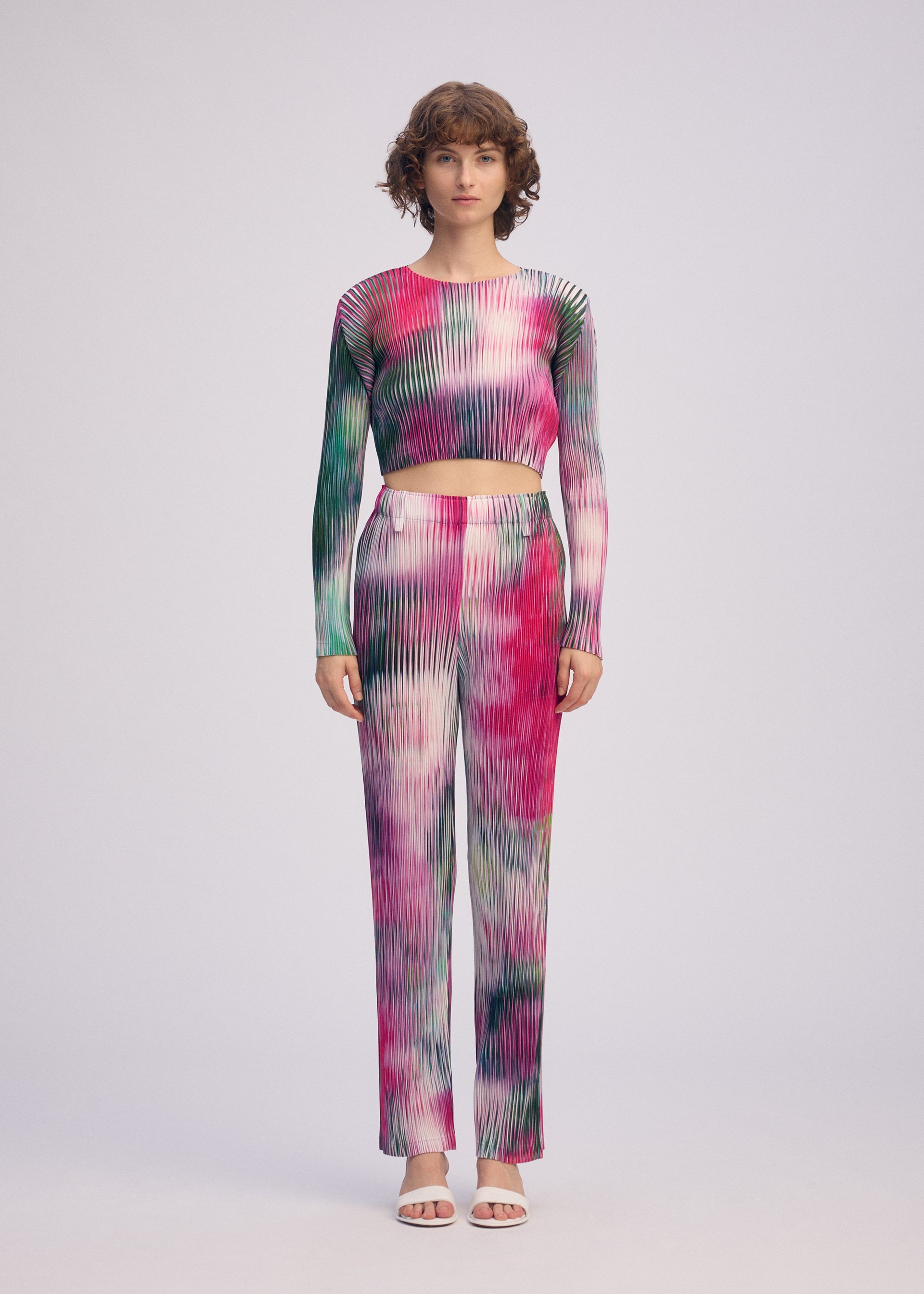 A model wears the ISSEY MIYAKE OBSCURE PLEATS prêt à porter.