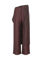 A detail shot of the ISSEY MIYAKE PLEATED ON PLEATS pants.