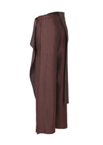 A detail shot of the ISSEY MIYAKE PLEATED ON PLEATS pants.