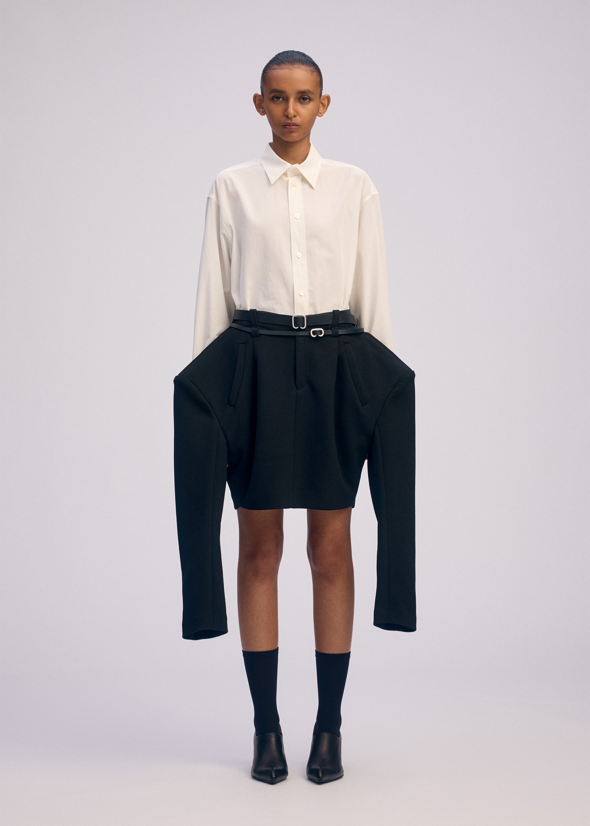 A model wears the ISSEY MIYAKE ARMS prêt à porter.