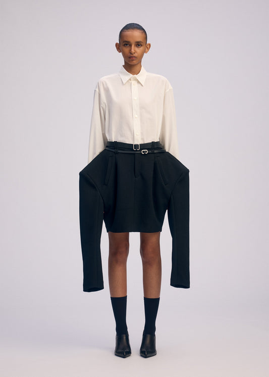 A model wears the ISSEY MIYAKE ARMS prêt à porter.