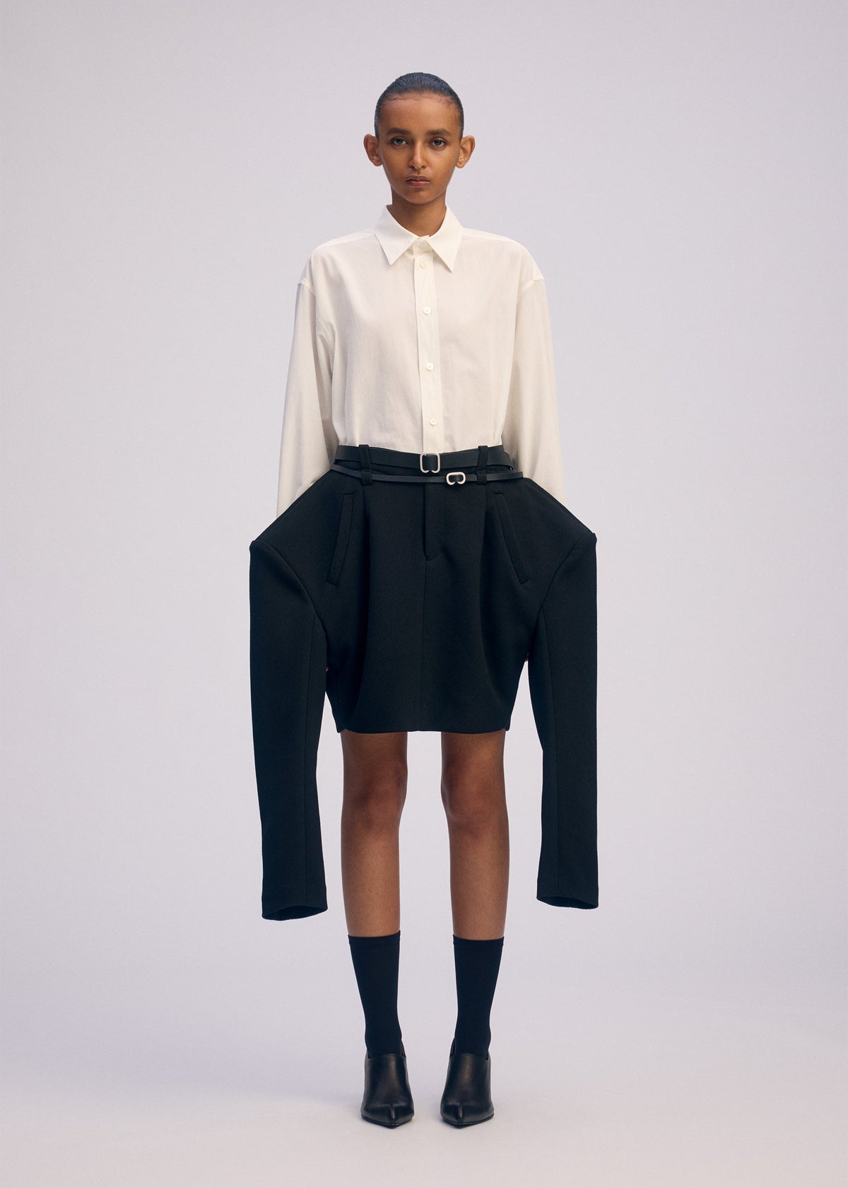 A model wears the ISSEY MIYAKE ARMS prêt à porter.