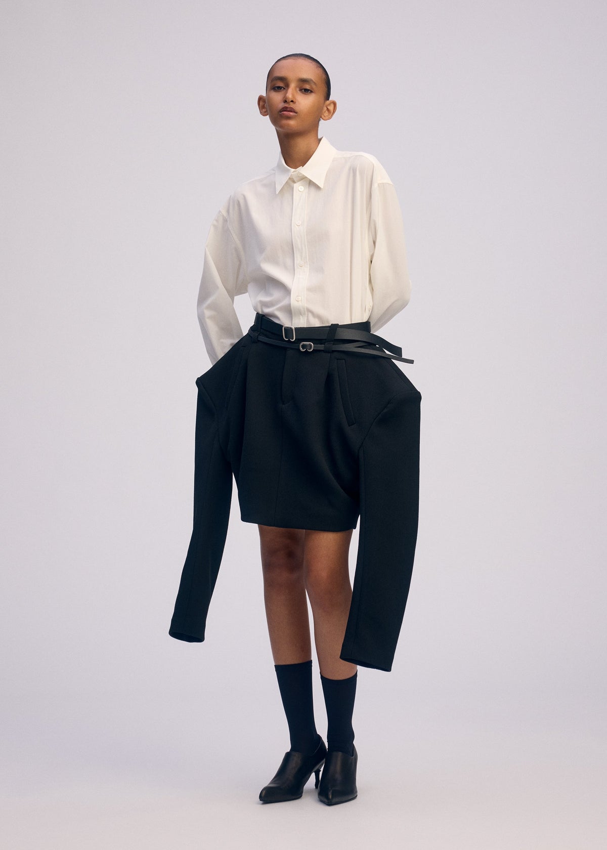 A model wears the ISSEY MIYAKE ARMS prêt à porter.