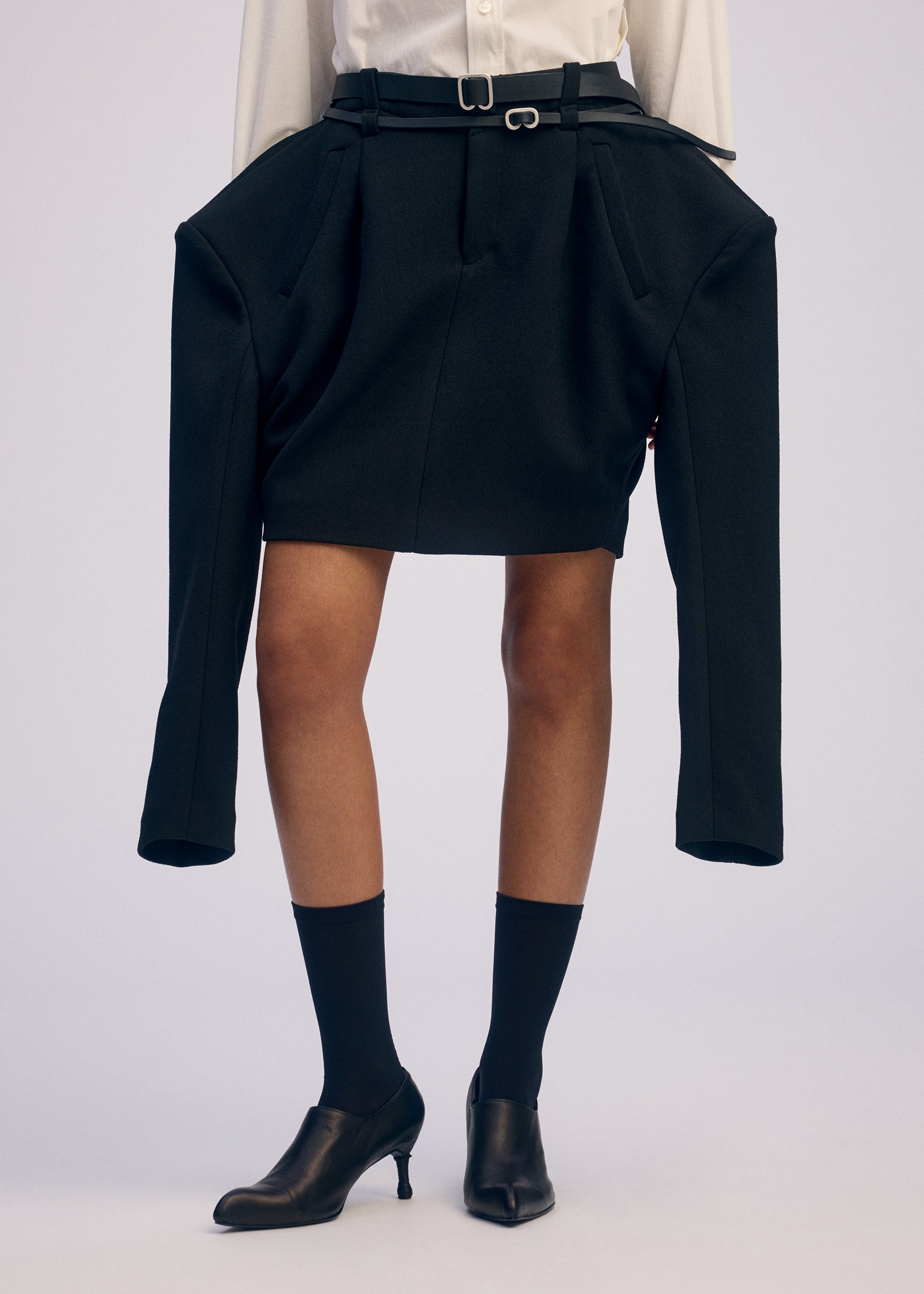 A model wears the ISSEY MIYAKE ARMS prêt à porter.