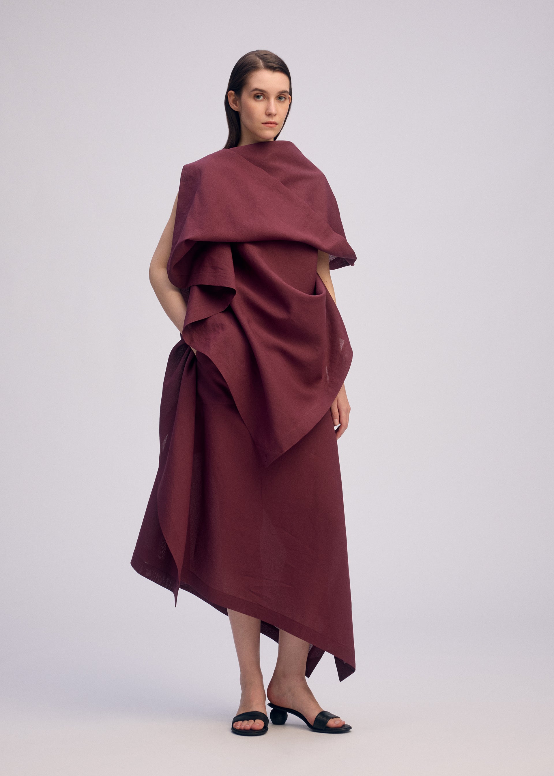 A model wears the ISSEY MIYAKE ALL SQUARES skirt.