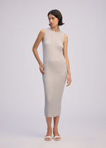 A model wears the ISSEY MIYAKE SLEEK PLEATS sleek-pleats-dress-burgundy.