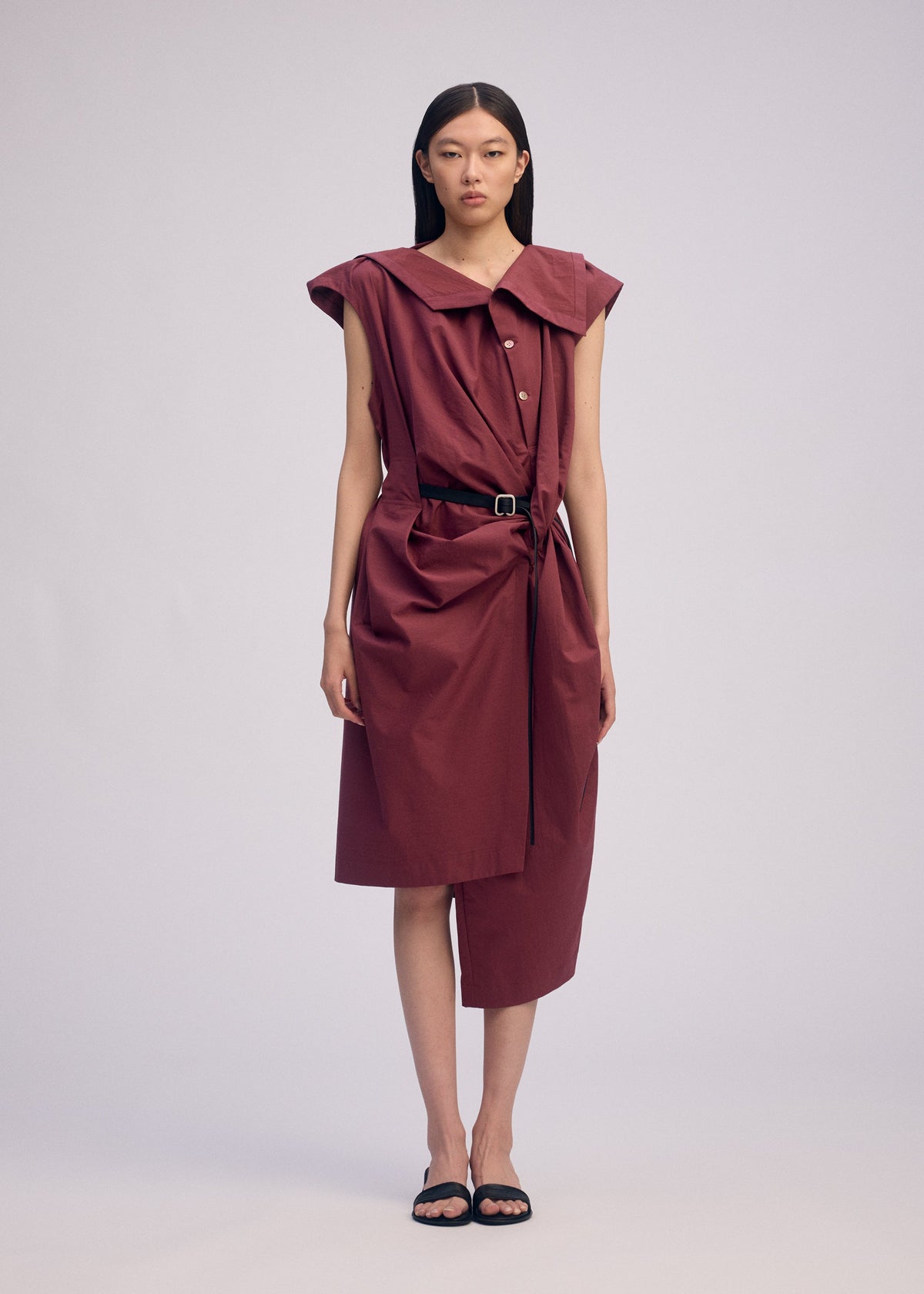 A model wears the ISSEY MIYAKE TWISTED DRAPE jumpsuit.