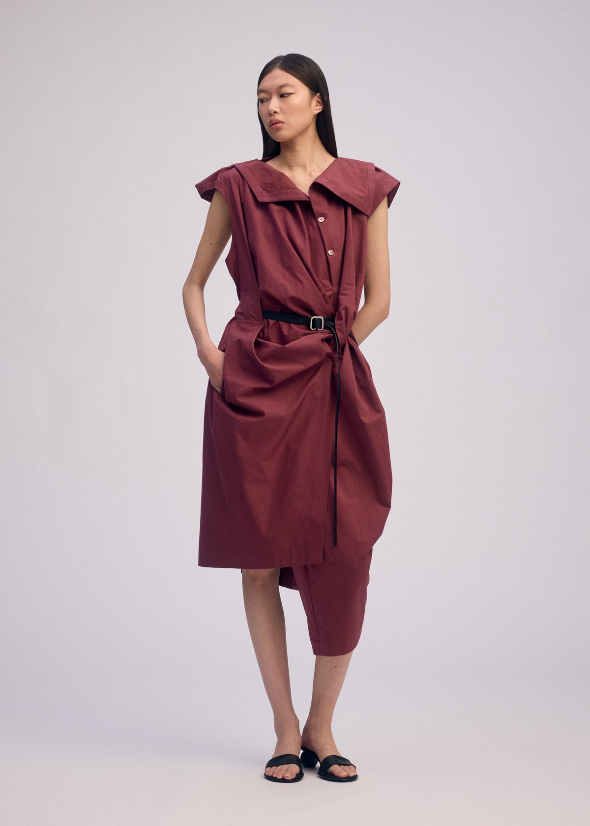 A model wears the ISSEY MIYAKE TWISTED DRAPE jumpsuit.