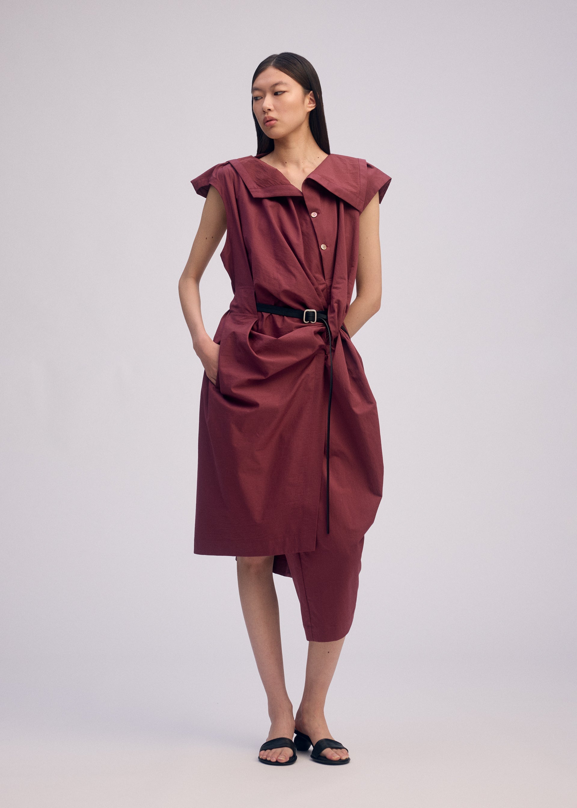 A model wears the ISSEY MIYAKE TWISTED DRAPE jumpsuit.