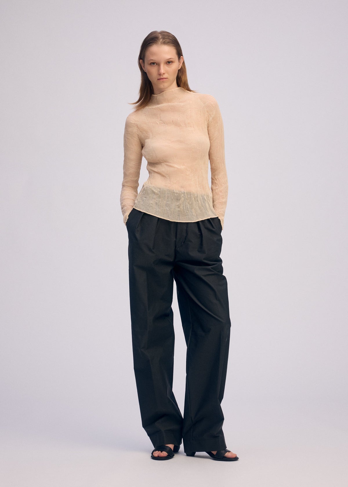 A model wears the ISSEY MIYAKE CHIFFON TWIST 1 prêt à porter.