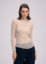 A model wears the ISSEY MIYAKE CHIFFON TWIST 3 shirt.